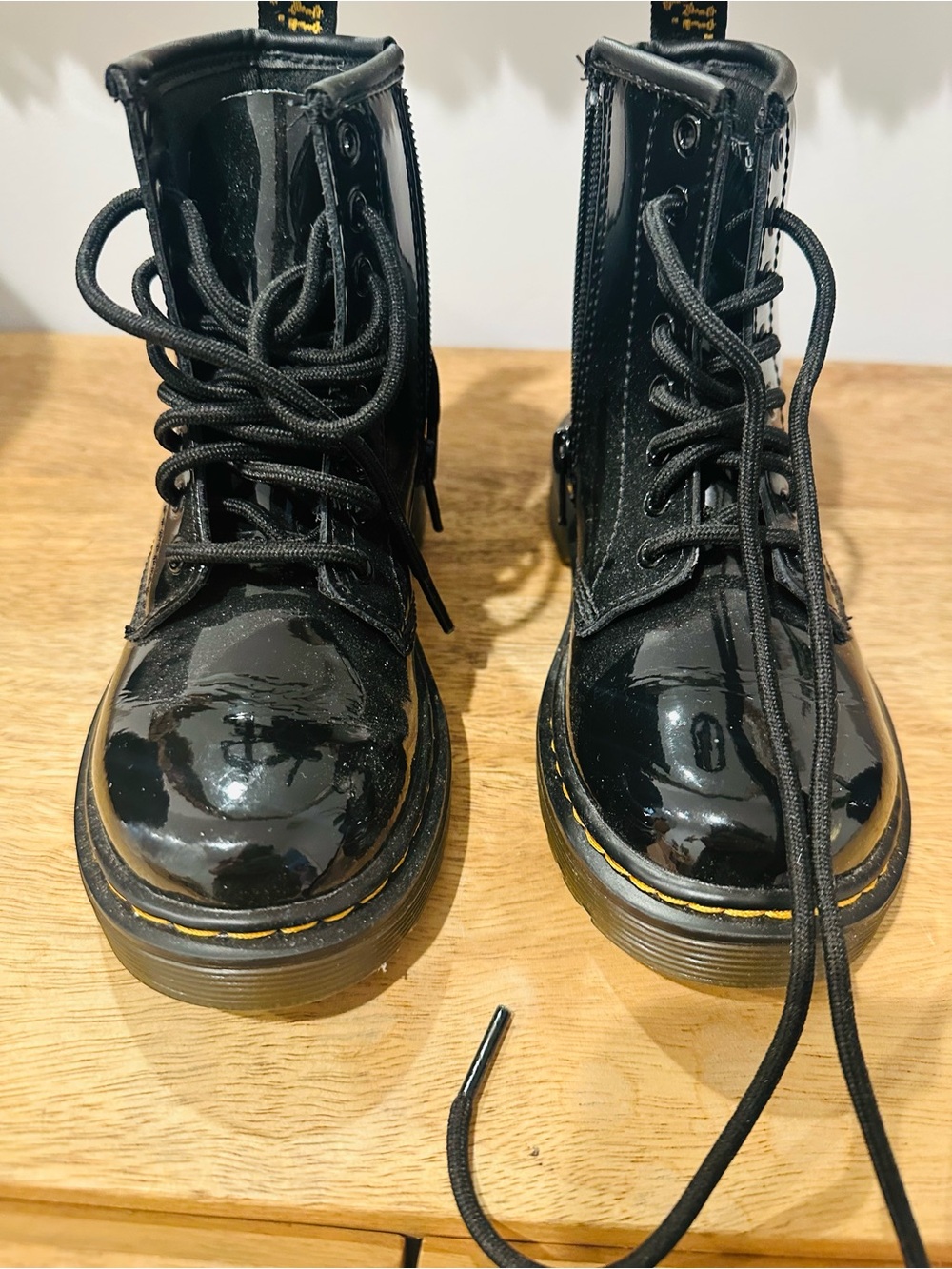 Dr. Martens Black Patent Lace-Up Boots with Yellow Stitching